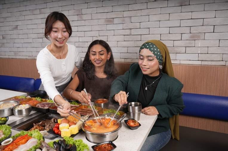 Guests enjoying a shared dining experience at Seoul Garden