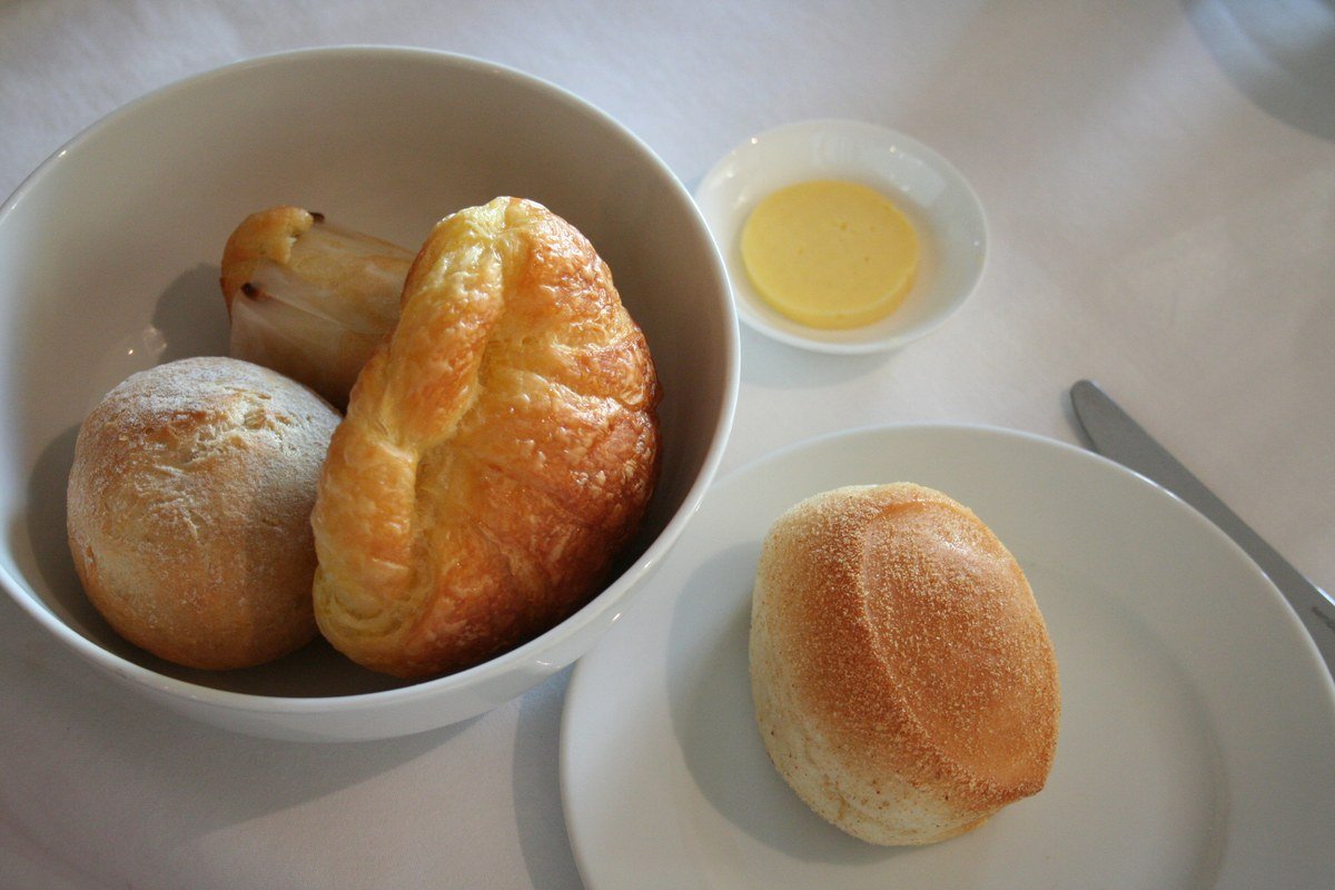 Fresh Filipino pandesal bread rolls served for breakfast or merienda