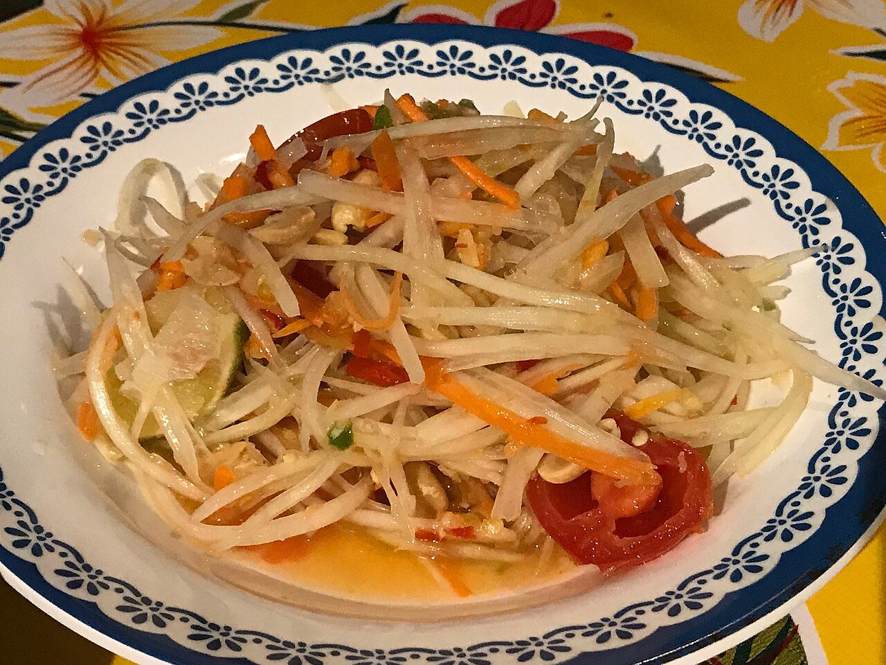 Thai som tam green papaya salad with chilli and lime