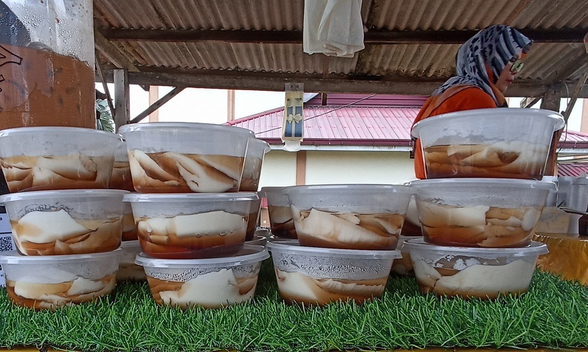 Containers of tau foo fah sold at a roadside stall in Negeri Sembilan