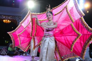Traditional dancer performing during a khantoke dinner in Chiang Mai