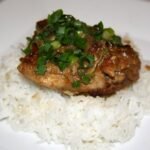 Filipino chicken adobo in a bowl with sauce