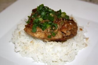 Filipino chicken adobo in a bowl with sauce