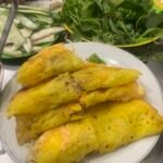 Vietnamese bánh xèo crepe with herbs in Đà Nẵng