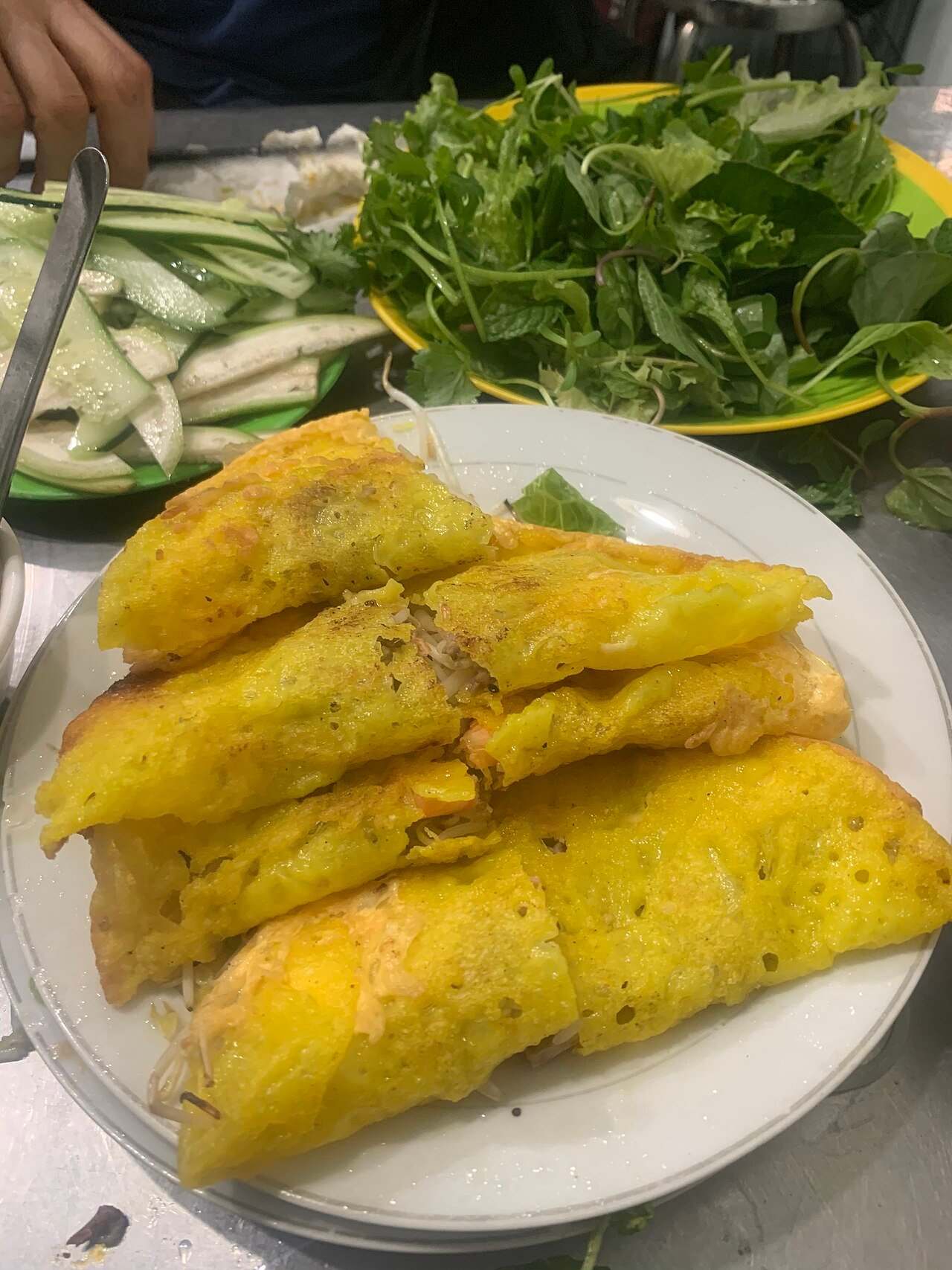 Vietnamese bánh xèo crepe with herbs in Đà Nẵng