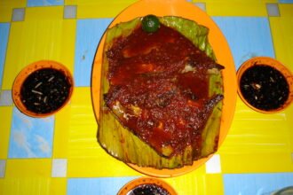 Ikan bakar in a Malaysian meal; the fish species is not identified in the photograph