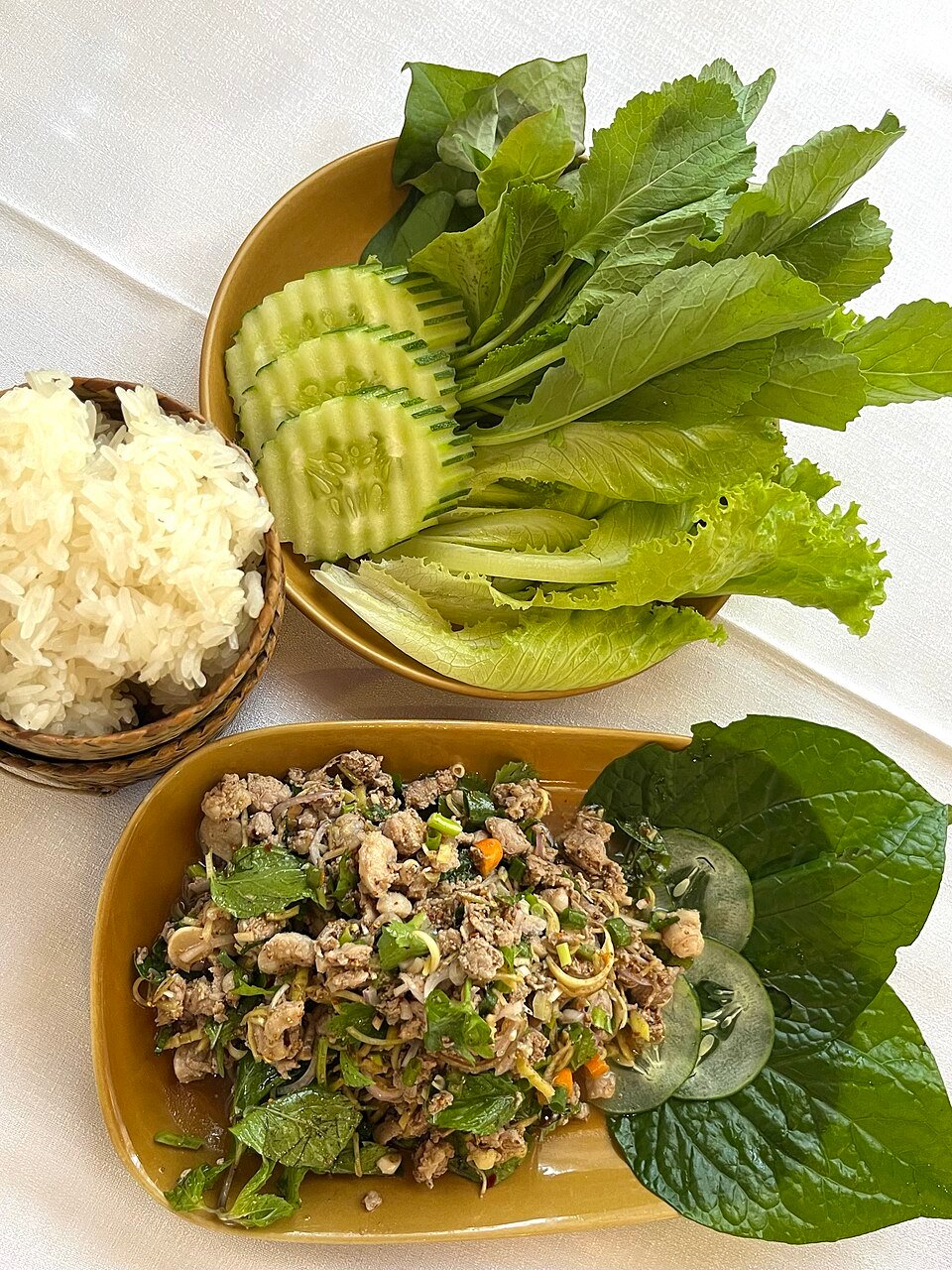 Lao fish laab served with sticky rice and fresh greens