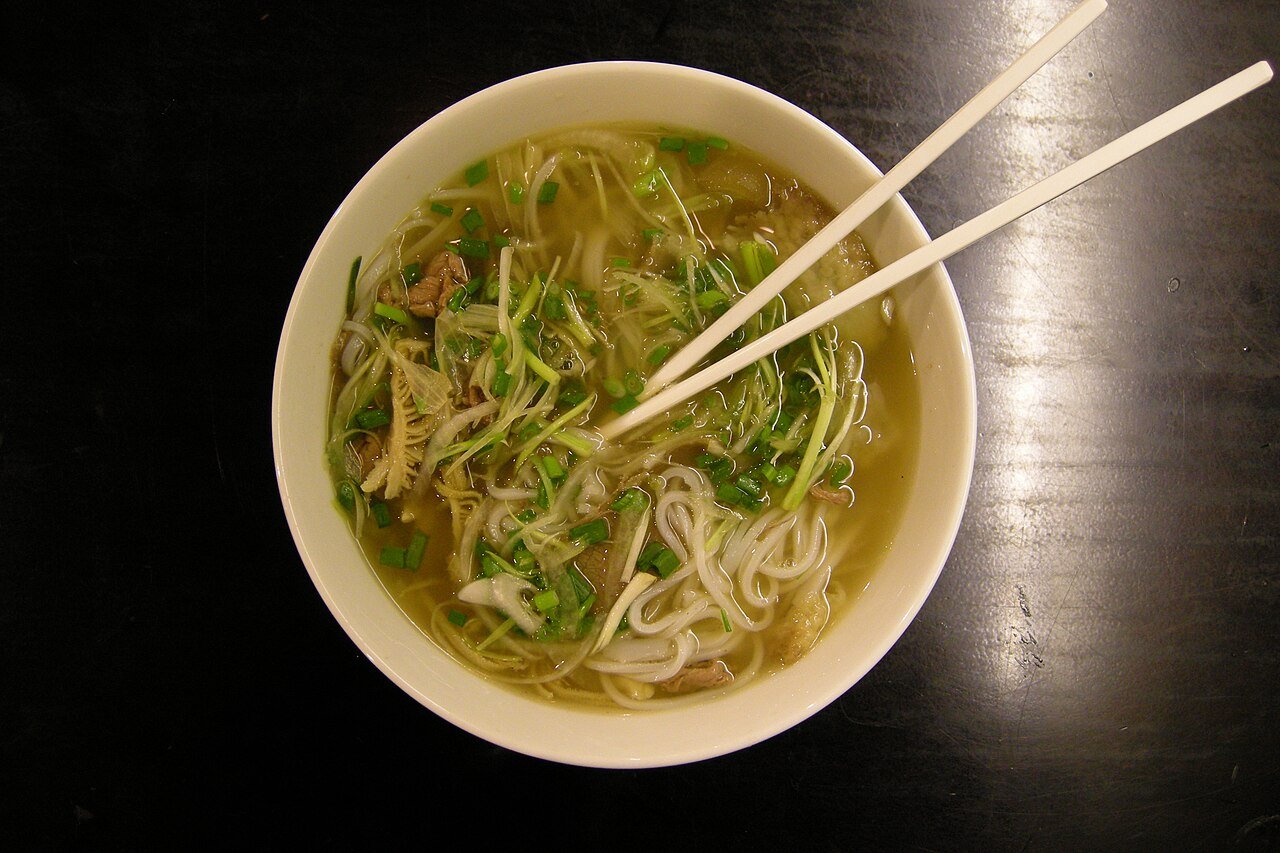 Vietnamese pho in Ho Chi Minh City with rice noodles and herbs