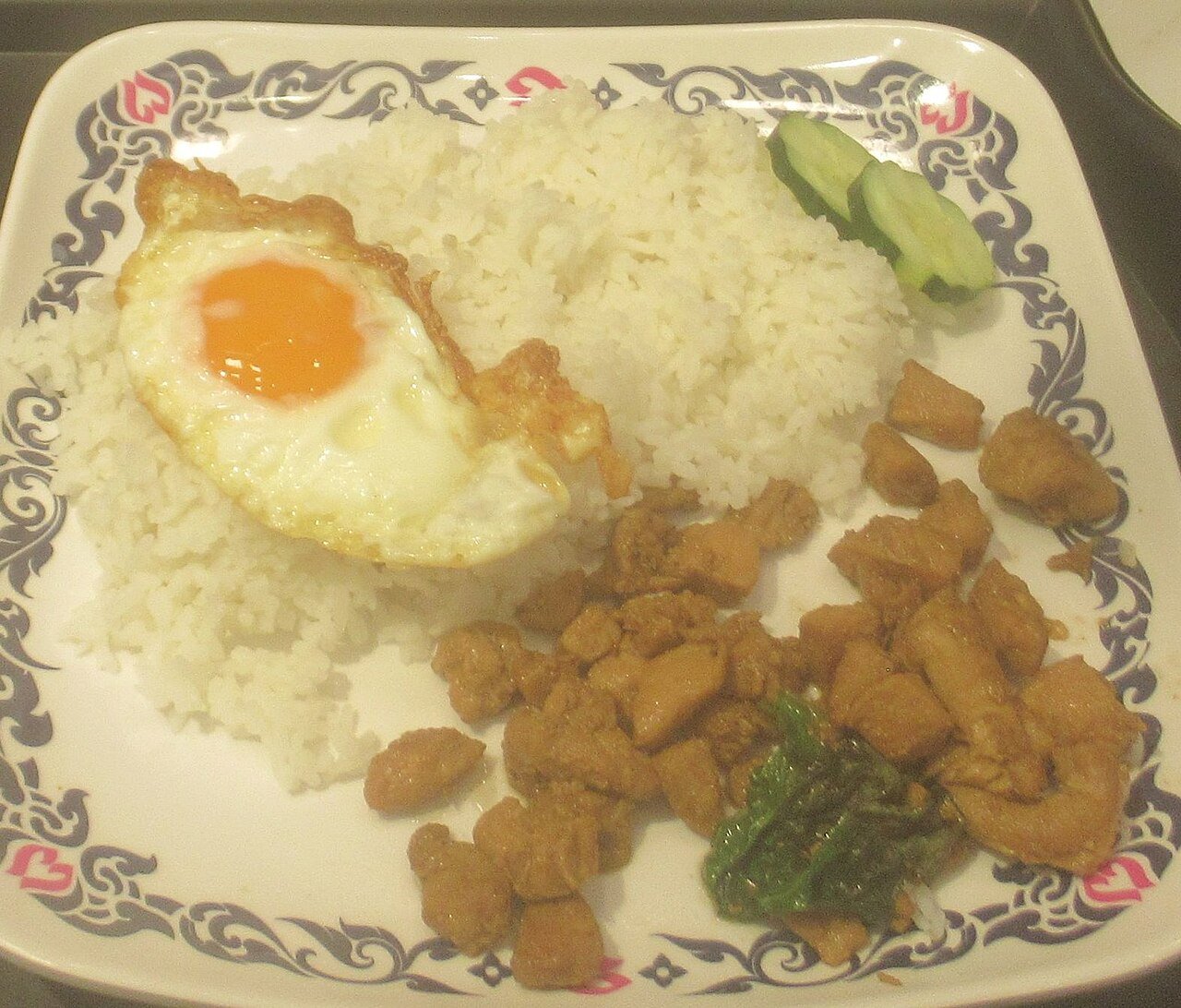 Another pad kra pao gai plate with egg and rice