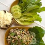 Lao fish larb with sticky rice and fresh vegetables