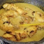Ayam salai dalam kuah masak lemak cili api di dalam kuali