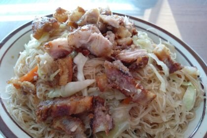 Pancit bihon rice noodles served on a plate