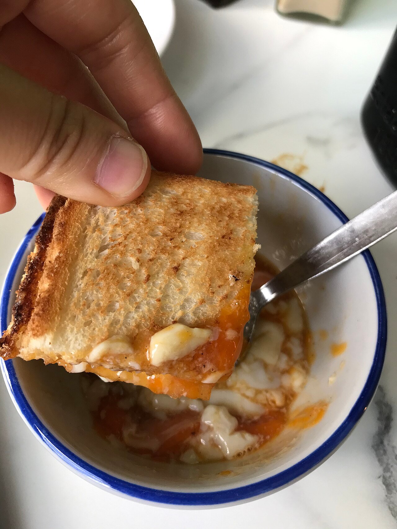 Kaya toast dipped into soft-boiled eggs in Singapore