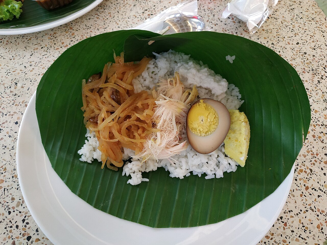 Nasi liwet rice dish with accompaniments from Solo
