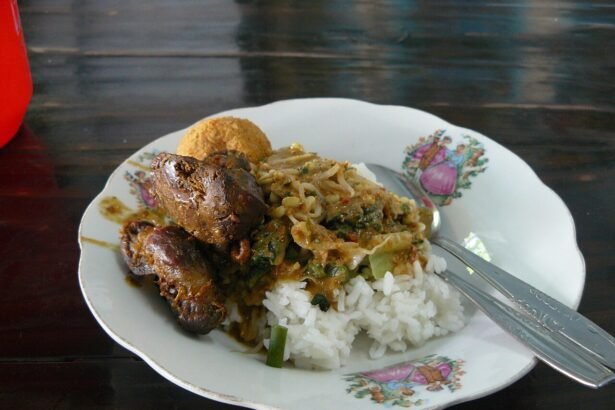 Madiun-style nasi pecel with rice, vegetables and sides, photographed in Malang